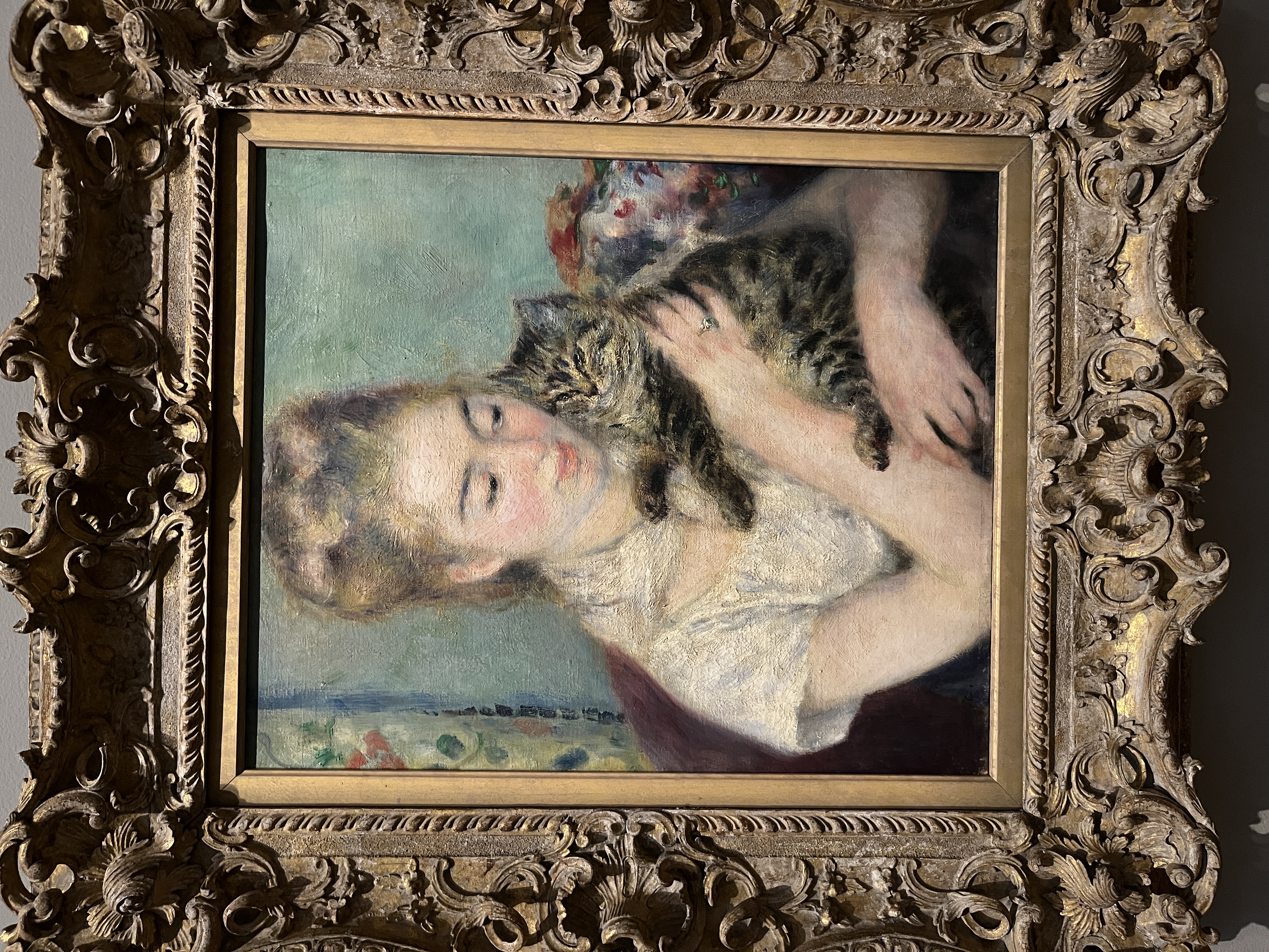 Painting of a woman holding a cat from the National Gallery